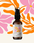 Bottle of Petal Woods product with a colorful floral background