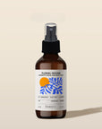 Bottle of 'Floral Ocean' by banyo on a beige background